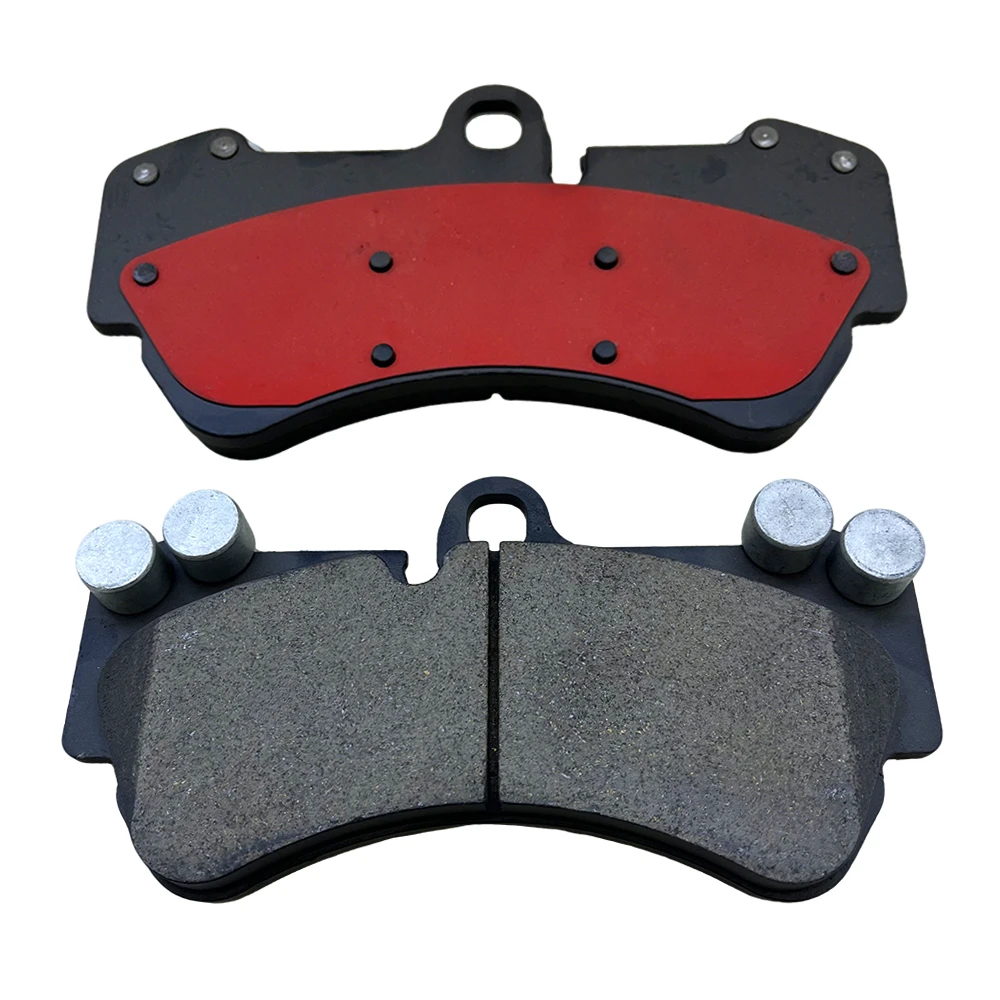 Ceramic brake pad pair, showing the friction surface and red backing plate